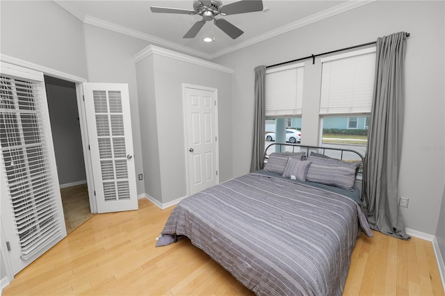 bedroom with wood-type flooring, ceiling fan, and crown molding