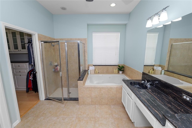 bathroom with vanity, tile patterned floors, and separate shower and tub