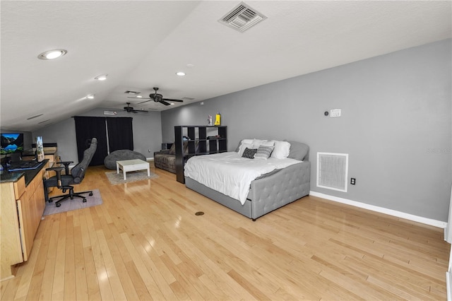 bedroom with wood-type flooring, vaulted ceiling, and ceiling fan