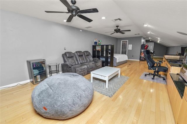 interior space with wood-type flooring and vaulted ceiling