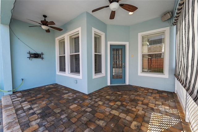 exterior space featuring ceiling fan