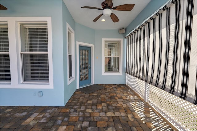 view of patio featuring ceiling fan