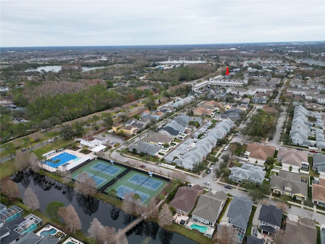 birds eye view of property with a water view