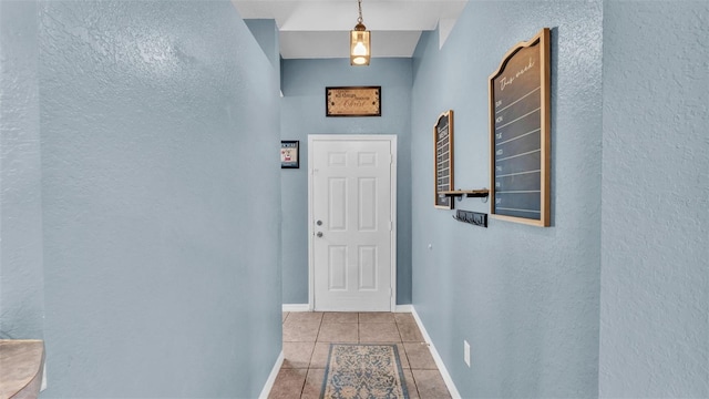 hallway with light tile patterned floors