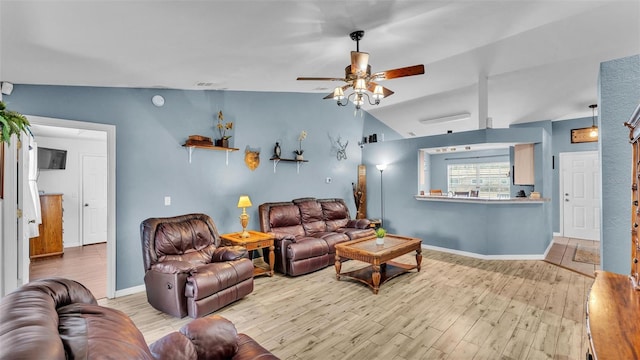 living room featuring lofted ceiling, ceiling fan, and light hardwood / wood-style flooring