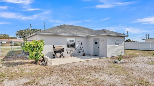 rear view of property featuring a patio