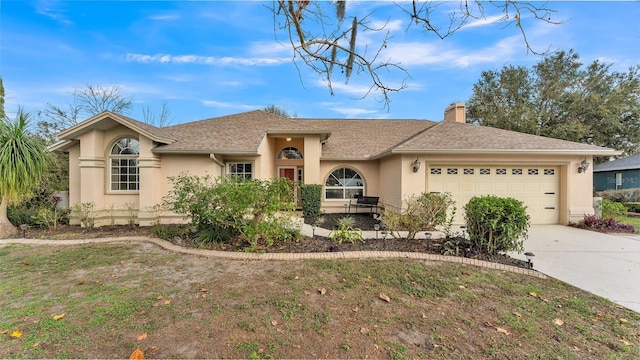 single story home with a garage and a front yard