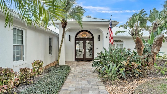 property entrance featuring french doors