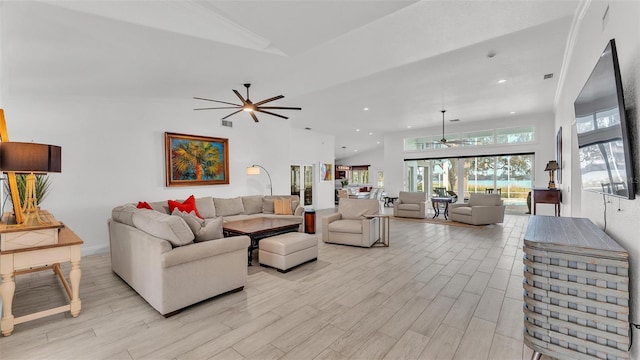 living room featuring ceiling fan, high vaulted ceiling, and light wood-type flooring