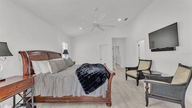 bedroom featuring high vaulted ceiling, ceiling fan, and light wood-type flooring