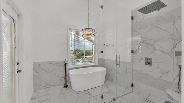 bathroom with tile walls and plus walk in shower