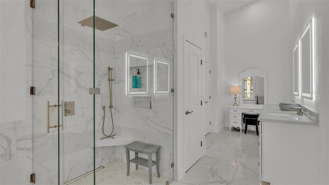 bathroom featuring vanity and a shower with door