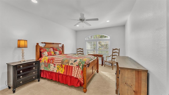 bedroom with light carpet and ceiling fan