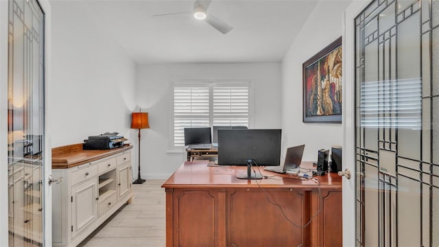 office space featuring ceiling fan and light hardwood / wood-style flooring