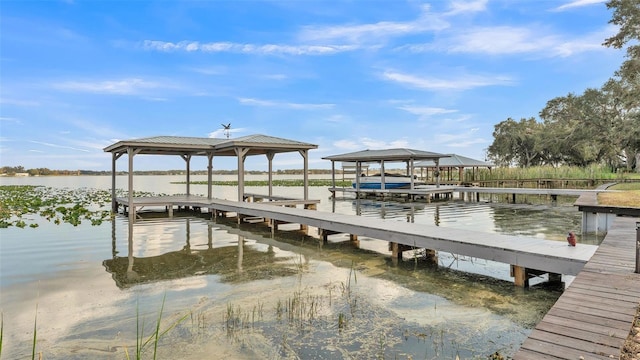 dock area with a water view and a gazebo