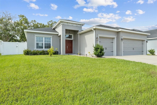 view of front facade with a garage and a front yard