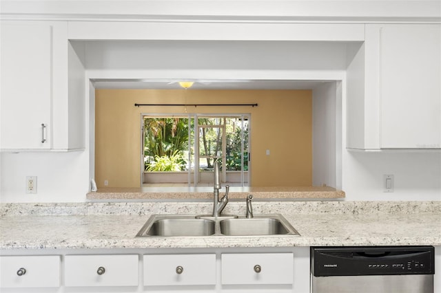 kitchen featuring white cabinetry, dishwasher, sink, and light stone counters