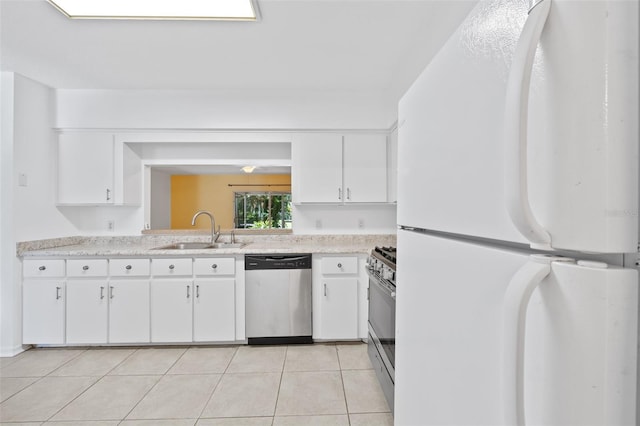 kitchen featuring sink, white cabinetry, white refrigerator, range with gas cooktop, and stainless steel dishwasher