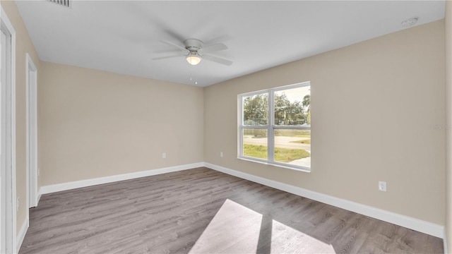 unfurnished room featuring ceiling fan and light hardwood / wood-style floors