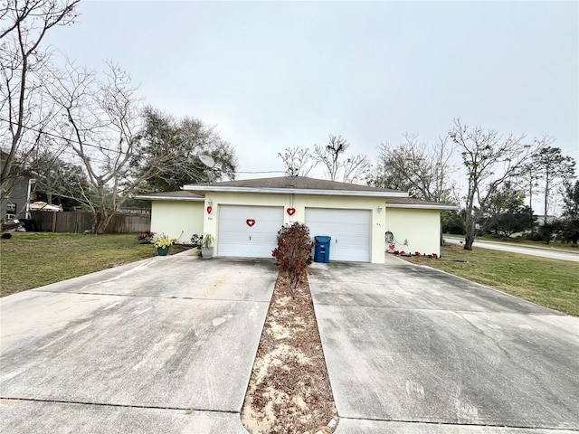 ranch-style house with a garage and a front lawn