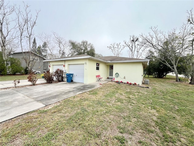 ranch-style home featuring a front lawn and a garage