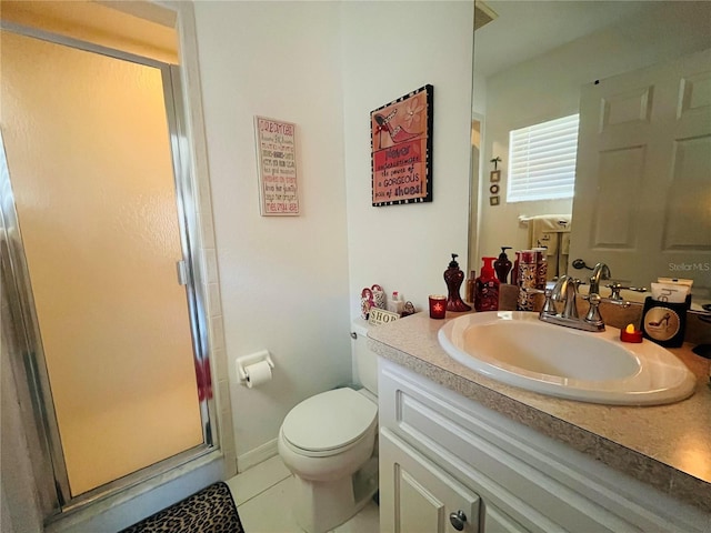 bathroom with toilet, a shower with shower door, vanity, and tile patterned flooring