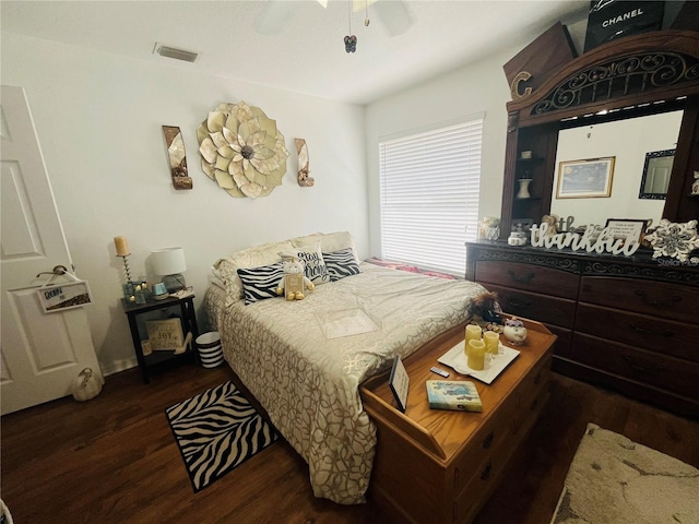 bedroom with ceiling fan and dark hardwood / wood-style floors