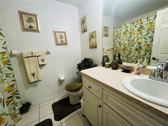 bathroom featuring tile patterned floors, toilet, and vanity