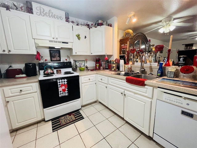 kitchen with light tile patterned floors, sink, dishwasher, range with electric cooktop, and white cabinets