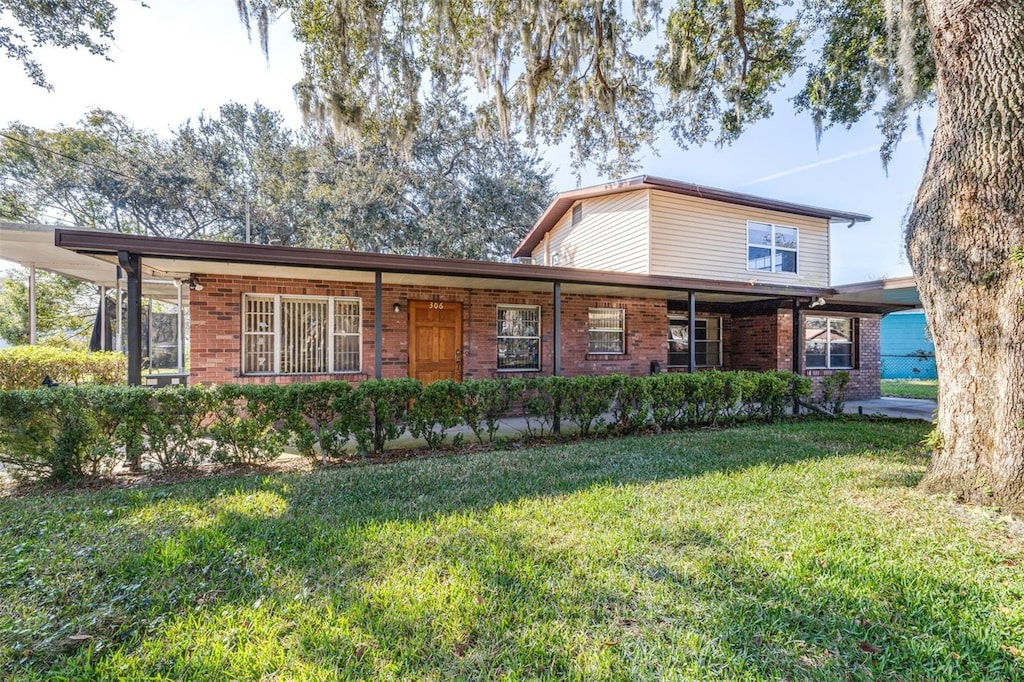 view of front of home with a front lawn