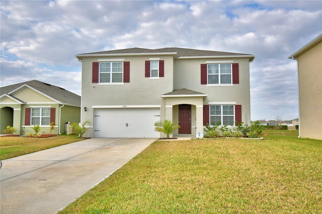 view of front of house featuring a garage and a front lawn