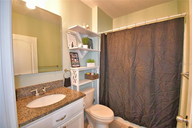 bathroom with vanity, curtained shower, a textured ceiling, and toilet