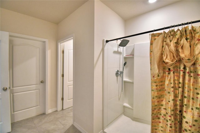 bathroom featuring tile patterned flooring and walk in shower