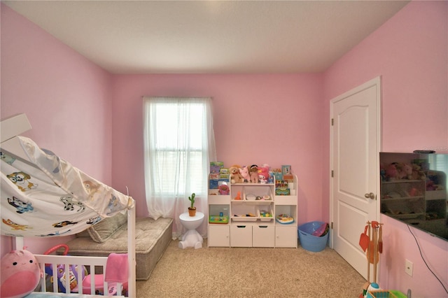 bedroom featuring light colored carpet