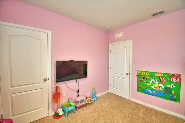 game room featuring light colored carpet