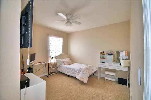 bedroom featuring ceiling fan and carpet