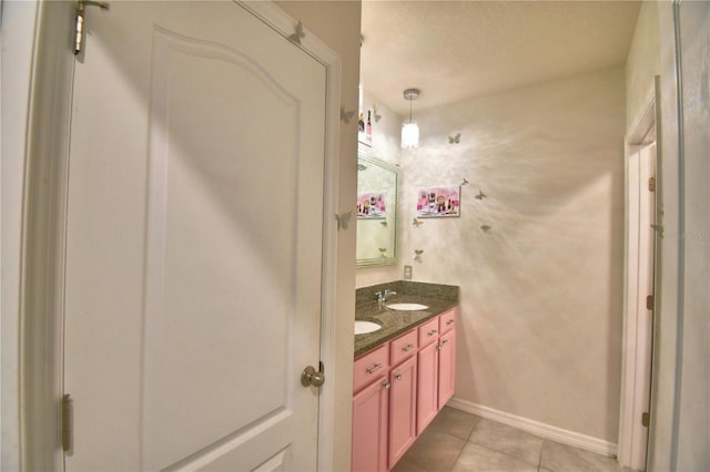 bathroom with tile patterned floors and vanity