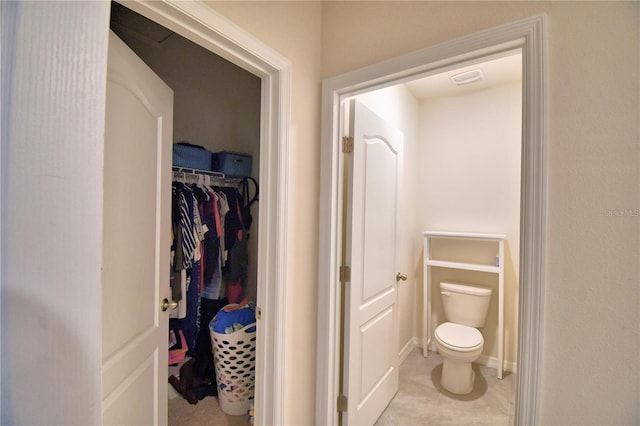 bathroom featuring tile patterned floors and toilet