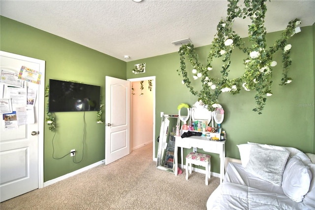 interior space with carpet floors and a textured ceiling