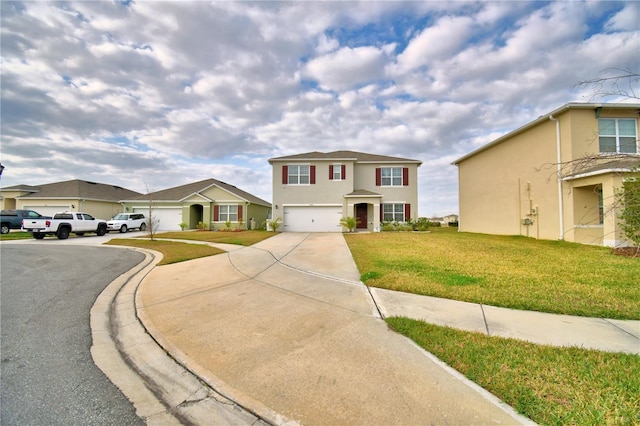 view of front of property with a garage and a front yard