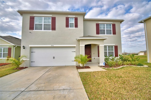 view of front of house featuring a garage and a front yard