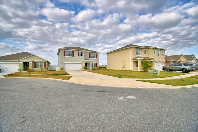 view of front of house with a garage and a front lawn