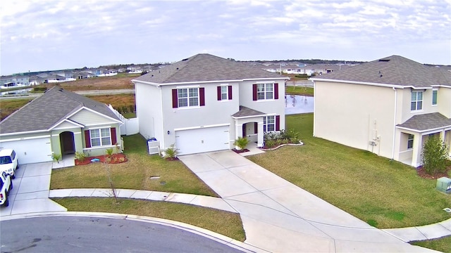 front of property with a garage and a front yard