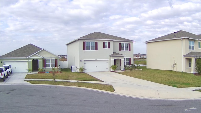 view of front property featuring a garage and a front yard