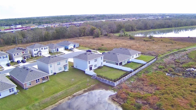 birds eye view of property with a water view