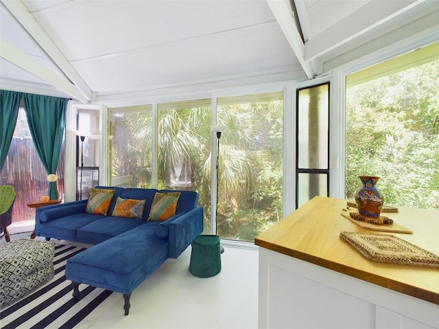 sunroom with beamed ceiling and a wealth of natural light