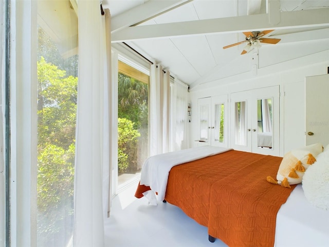 bedroom with multiple windows and vaulted ceiling with beams