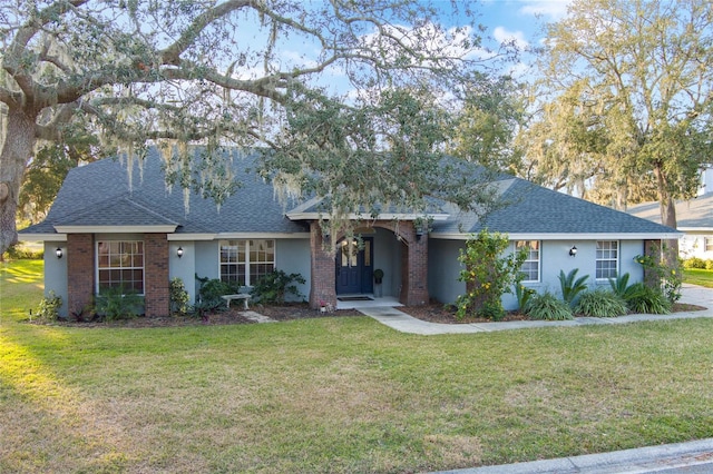 single story home featuring a front yard