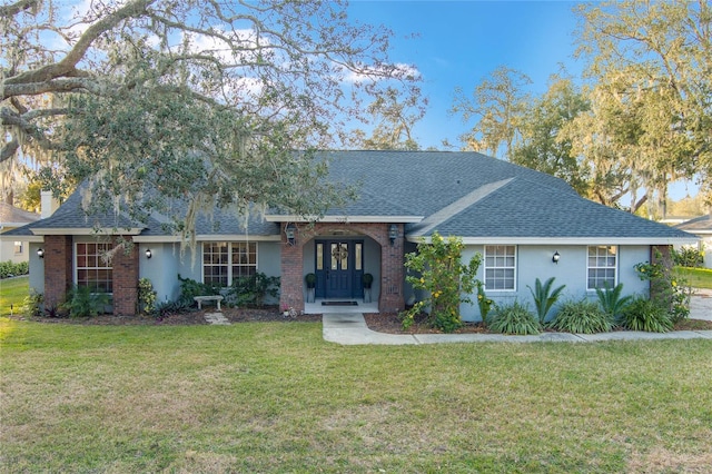 ranch-style home featuring a front yard