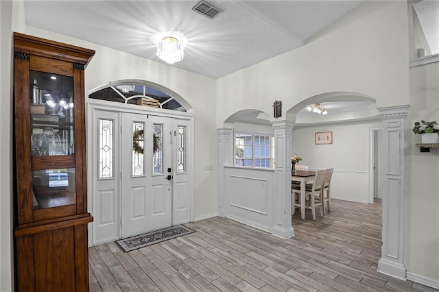 entryway featuring ornate columns